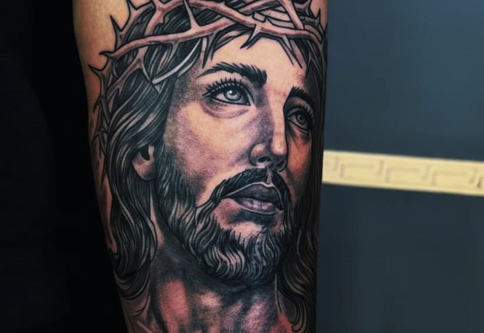Black and grey religious portrait with a dove