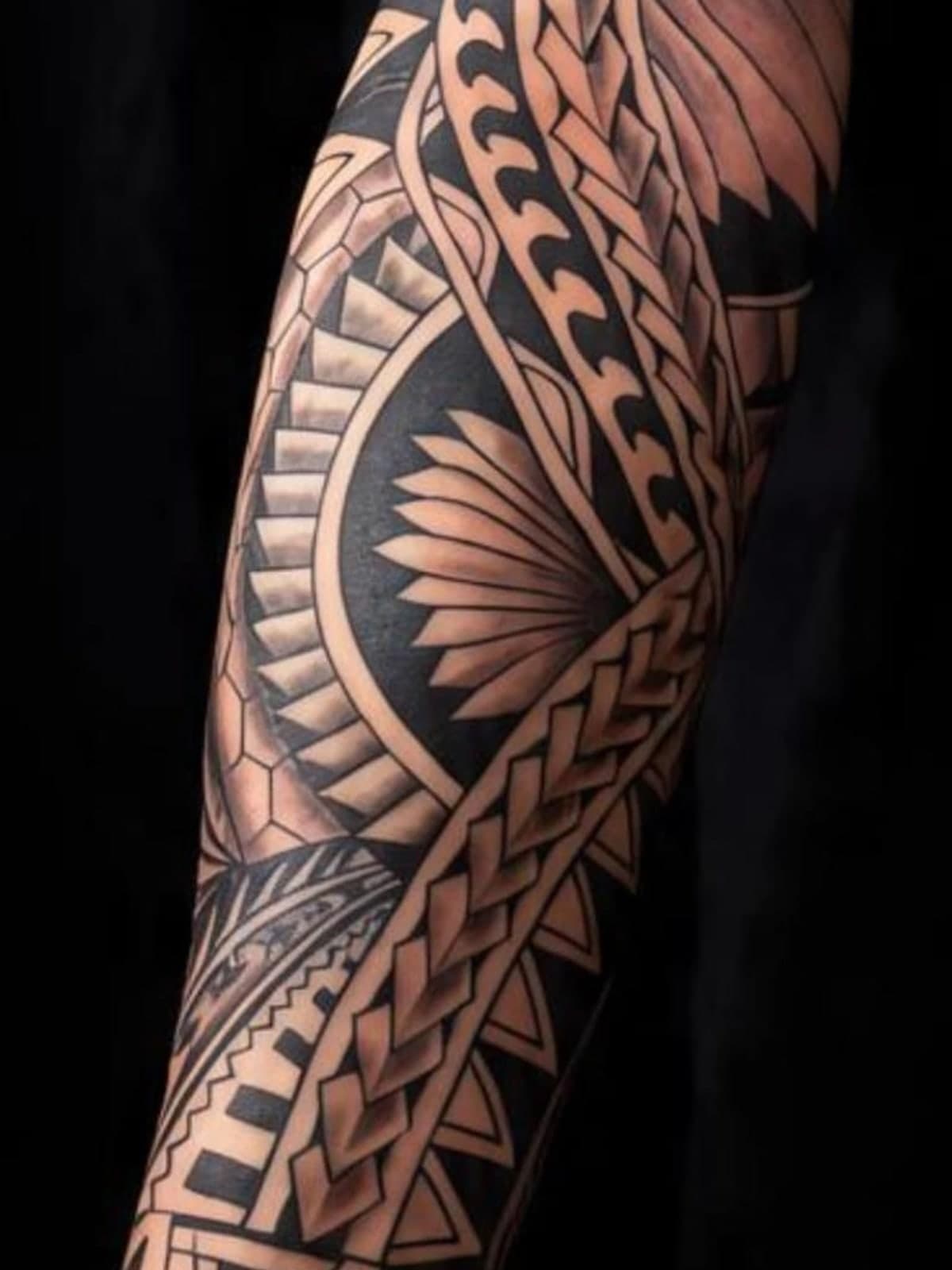 Tribal sleeve with banded blackwork following the arm